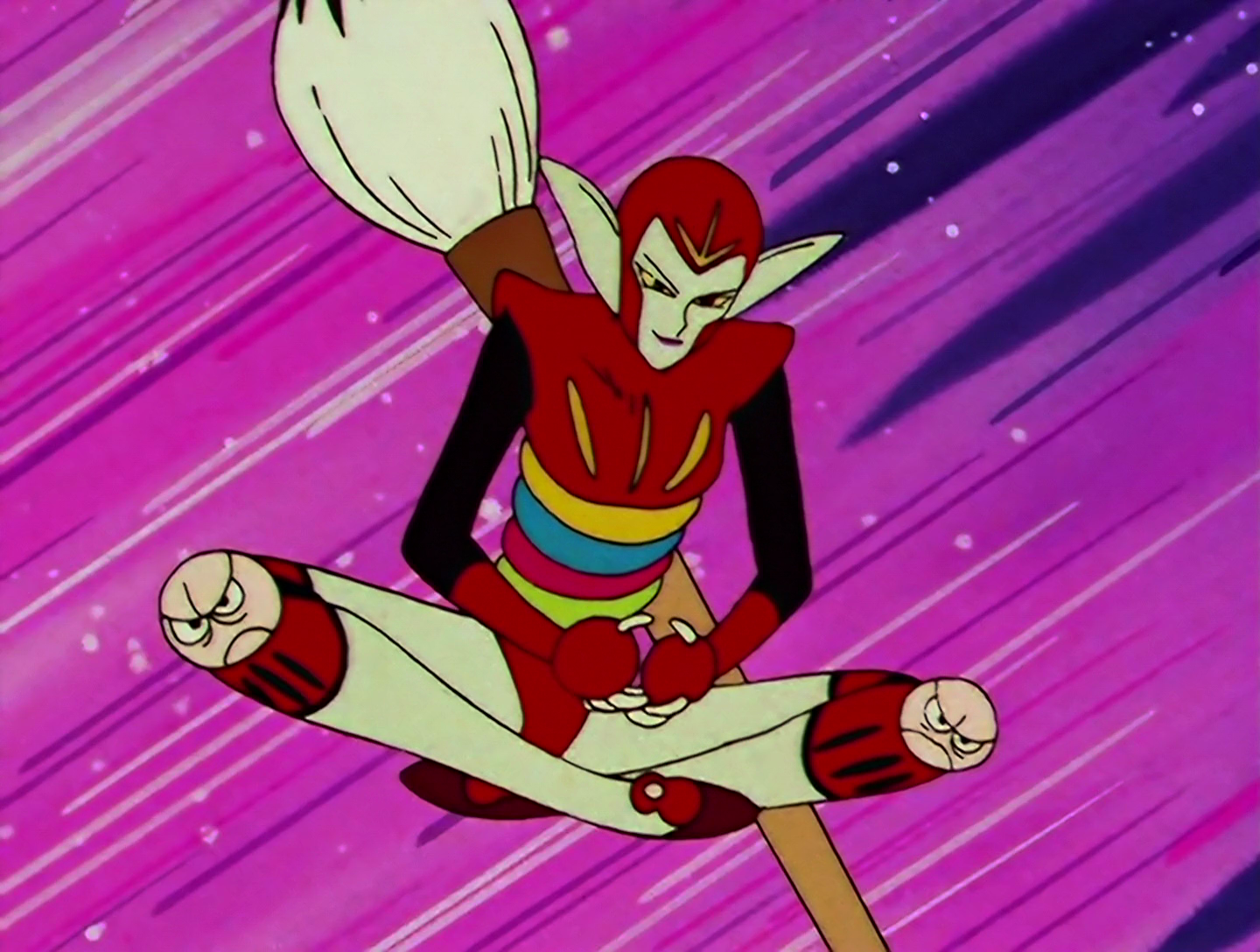 Daruma, a Daimon from Sailor Moon episode 105. She has a pale face and large pointed ears, with a red helmet and upper body. Her lower torso is made up of multiple stacked colored discs. Her knees have scowling daruma faces on them, and she has a huge ink brush on her back. Why, for this season, this design is positively restrained. Hold that thought.